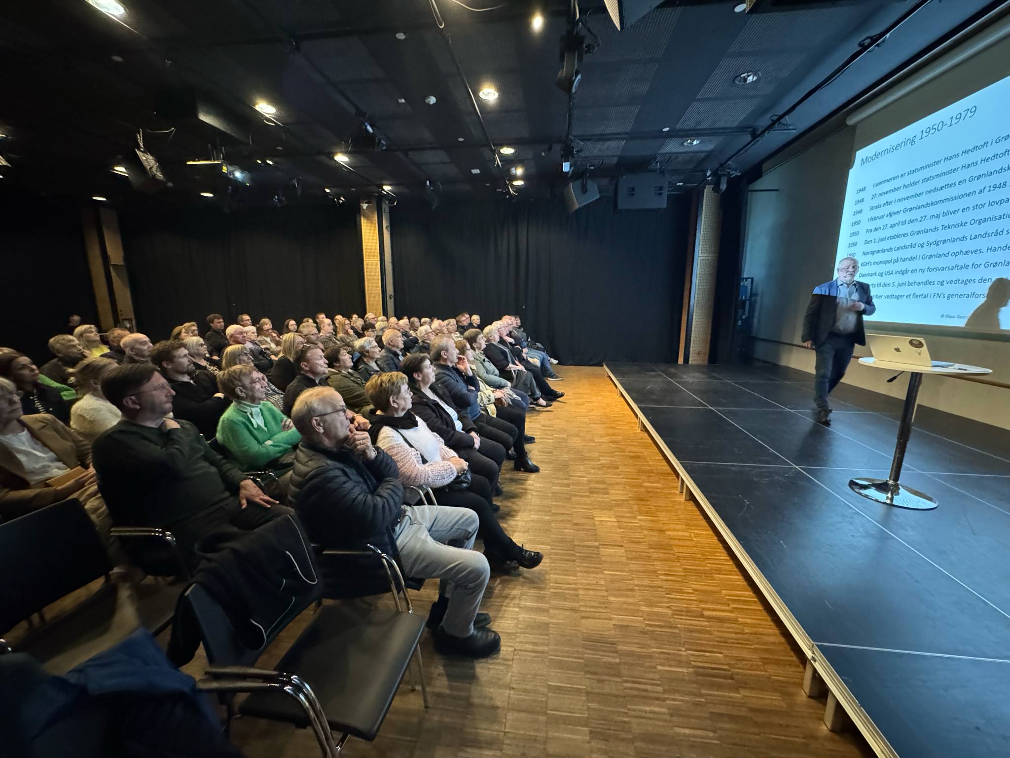 Audience listening to a presentation